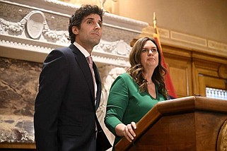 FILE - Governor Sarah Huckabee Sanders answers questions from reporters with her husband, Bryan Sanders, during a press conference announcing her husband as the head of a new council to promote outdoor recreation and tourism on Tuesday, Jan. 24, 2023. (Arkansas Democrat-Gazette/Stephen Swofford)